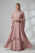 Female model wearing Retro Project Dusty Rose Abaya on light gray background