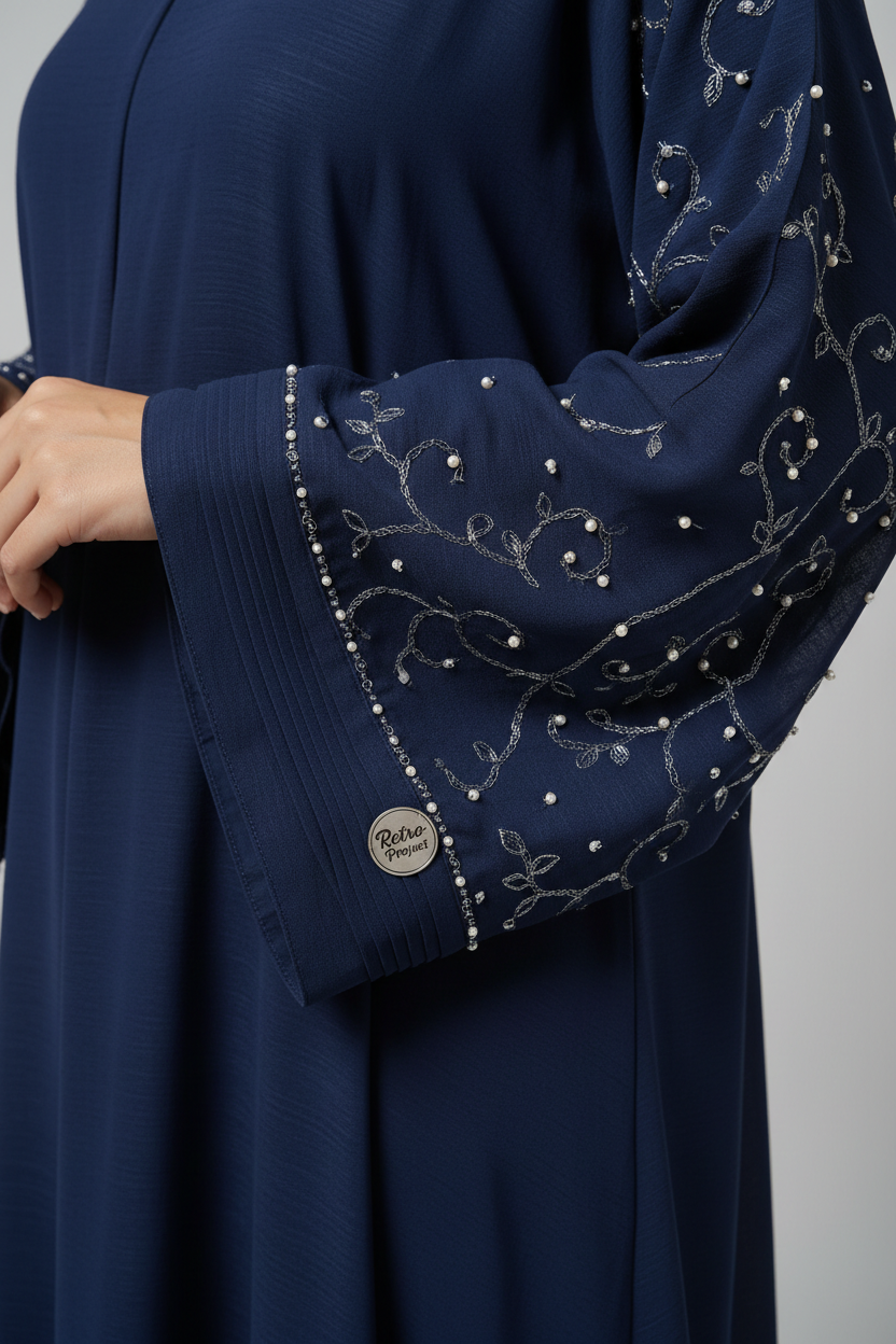 Close-up detail of Retro Project Navy Blue Abaya fabric and sleeve